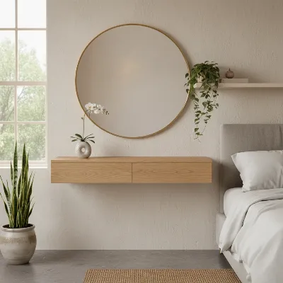 Light wood floating vanity in a sunny bedroom with a large round mirror